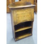 AN EARLY TWENTIETH CENTURY OAK FALL-FRONT WRITING BUREAU WITH OPEN SHELVES BELOW