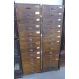 A PAIR OF TALL PINE MULTI-DRAWER FILING CABINETS, EACH 1'6" WIDE, 6' HIGH