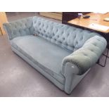 AN EARLY 1900's CHESTERFIELD STYLE SOFA, THREE SEATER IN DUCK EGG BLUE VELVET ON BUN FEET