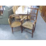 A NINETEENTH CENTURY OAK SPINDLE BACK RUSH SEATED OPEN ARMCHAIR (A.F.) AND AN OAK CANE SEAT TUB