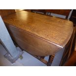 A VICTORIAN OAK GATELEG TABLE, BARLEY TWIST LEGS ON BUN FEET