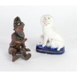 STAFFORDSHIRE POTTERY POODLE GROUP, modelled seated with two puppies, on a gilt lined oval blue