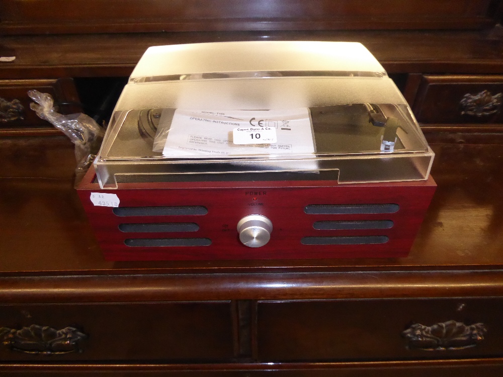 A SMALL MODERN TABLE-TOP RECORD PLAYER