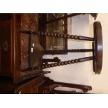 A TWO TIER TORCHERE STAND WITH CIRCULAR TOP ON THREE BOBBIN TURNED LEGS