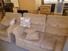 A SETTEE AND MATCHING LOUNGE ARMCHAIR, COVERED IN FAWN SELF PATTERNED FABRIC