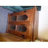 A SMALL TWO DOOR SOLID WOOD CABINET, WITH WROUGHT IRON DECORATION TO THE DOORS, 92cm high, 66cm