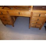 AN EARLY/MID 20TH CENTURY LIGHT OAK PEDESTAL DESK, SINGLE CENTRAL DRAWER, EACH PEDESTAL WITH SLIDE