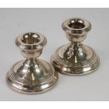 PAIR OF FILLED SILVER CANDLE HOLDERS, of typical form, 2 3/4" (7cm) high, Birmingham 1976 (2)