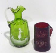 A VICTORIAN MARY GREGORY GREEN AND WHITE GLASS JUG AND A VICTORIAN RUBY STAINED GLASS MUG (2)
