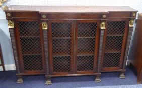 19TH CENTURY EMPIRE STYLE MAHOGANY BREAKFRONT DWARF BOOKCASE enclosed by four doors with metal