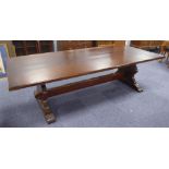 LARGE TWENTIETH CENTURY DARK STAINED OAK REFECTORY TABLE, with thick plank top raised on shaped