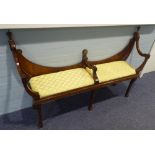 A MAHOGANY WINDOW SEAT WITH RAISED SCROLL ENDS, low raised back, central upholstered seat, on four