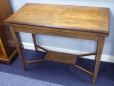 EDWARDIAN INLAID ROSEWOOD OBLONG CARD TABLE with swivel and flap-top, with leather lined interior,