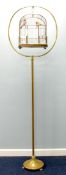 EARLY 20th CENTURY BRASS DOME TOPPED OBLONG BIRD CAGE on brass floor stand with circular base and