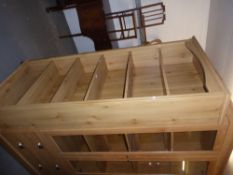 A PINE EFFECT OPEN BOOKCASE OF SIX TIERS, 2'8" WIDE