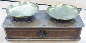 SHOP BALANCE SCALE with two loose brass circular pans operating on an inlaid mahogany oblong box