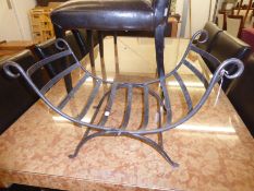 A WROUGHT IRON LOG BASKET WITH SCROLL ENDS