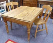 A PINE OBLONG KITCHEN TABLE WITH FOUR PLANK TOP, plain apron, on four turned tapering legs,