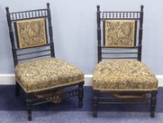 PAIR OF CIRCA 1900 ARTS & CRAFTS STYLE EBONISED NURSING CHAIRS in the manner of E. W. Godwin (2)