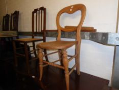 AN EDWARDIAN LINE INLAID MAHOGANY BEDROOM CHAIR, WITH CANE SEAT AND A VICTORIAN BALLOON BACK