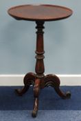 EARLY 19th CENTURY MAHOGANY TRIPOD TABLE the circular top having cavetto edge, on turned and