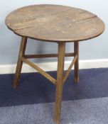 AN ANTIQUE OAK TOPPER CIRCULAR CRICKET TABLE on three splayed straight legs joined by three