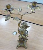 GILT METAL CANDELABRUM with gilt metal floral and foliate two branch top, held up by a gilt resin
