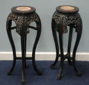 PAIR OF EARLY 20th CENTURY CHINESE CARVED WOODEN VASE STANDS with marble inset tops, 26 1/2" (67.