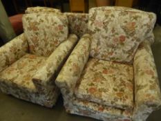 LOUNGE SUITE OF THREE PIECES WITH FLORAL PRINTED FABRIC LOOSE COVERS, VIZ A THREE SEATER SETTEE