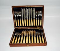 CASED SET OF 12 PAIRS FISH EATERS with bone handles and silver ferrules hallmarked Sheffield 1913 in