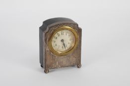 GEORGE V ENGINE TURNED SILVER FRONTED DRESSING TABLE CLOCK with 2" Arabic dial and 'Genuine Ebony'