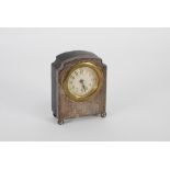 GEORGE V ENGINE TURNED SILVER FRONTED DRESSING TABLE CLOCK with 2" Arabic dial and 'Genuine Ebony'