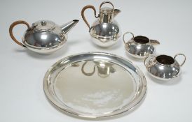 CHRISTOPHER DRESSER INSPIRED ELECTROPLATE TEA SET OF THREE PIECES, circular and squat, the TEAPOT