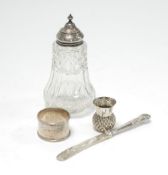 GEORGE V ENGRAVED SILVER NAPKIN RING, Birmingham 1916, TOGETHER WITH A CUT GLASS SUGAR CASTER,