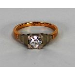 18ct GOLD AND PLATINUM RING, with a round brilliant cut solitaire diamond in a square setting with