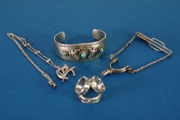 BROAD BANGLE, the open top set with three turquoise, open back; relating 'Sterling' and THREE