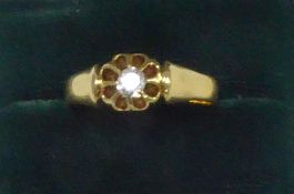 PROBABLY LATE VICTORIAN GOLD RING, with an old cut solitaire diamond in a floral claw setting,