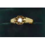 PROBABLY LATE VICTORIAN GOLD RING, with an old cut solitaire diamond in a floral claw setting,