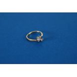 A 18ct YELLOW GOLD AND PLATINUM TWO STONE DIAMOND SET CROSSOVER RING, each 0.20ct