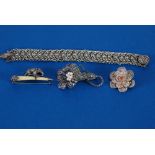 AN EARLY TWENTIETH CENTURY WHITE METAL FILIGREE WORK IMBRICATED LINK BRACELET, a white metal and