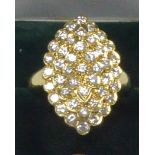 18ct GOLD RING, with a marquise shaped four tier cluster of forty three small uniform round