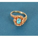 14k GOLD CROSS-OVER RING, with irregular nugget pattern top set with an oval turquoise flanked by