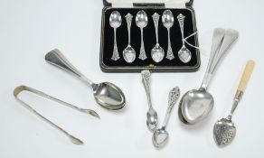 SET OF SIX EP TEASPOONS, with fancy rococo embossed handles, in case; a PAIR OF SUGAR TONGS to