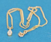 9k GOLD FINE CHAIN NECKLACE, 16" long, 3.4gms and the PENDANT, collet set with a tear shaped