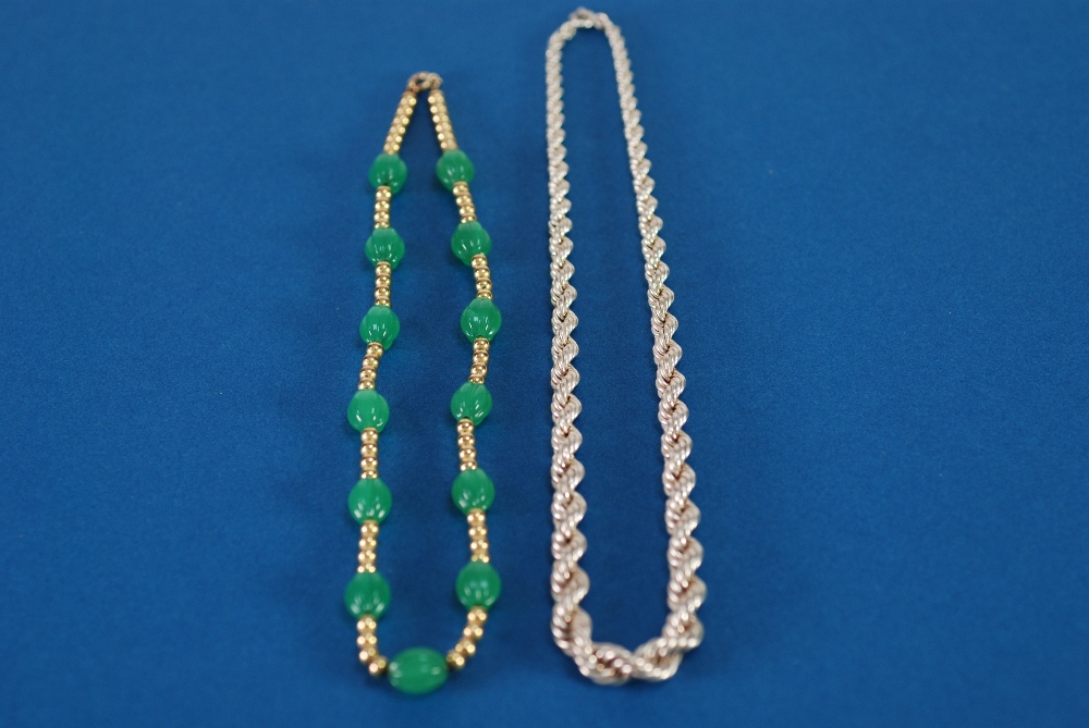 A GILT METAL AND GREEN HARDSTONE BEAD NECKLACE, TOGETHER WITH A 'Sterling' silver braided