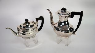 GEORGIAN STYLE SILVER TEAPOT, of stepped oval form with reeded rim, blackwood handle and finial,