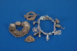 A COIN BRACELET, comprising 24 chain linked and overlapping silver three penny pieces, mainly George