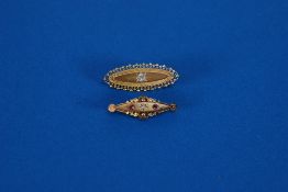 AN EDWARDIAN 15ct GOLD ELLIPTICAL BROOCH, set with diamond approx 0.40ct, and ANOTHER SIMILAR,
