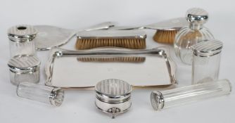 AN ELEVEN PIECE 1920's SILVER DRESSING TABLE SET, COMPRISING; A TRAY, SCENT BOTTLE, HAND MIRROR,