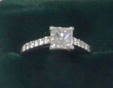 PLATINUM RING, set with a princess cut square diamond, weighing 1.01ct, in a four claw setting,